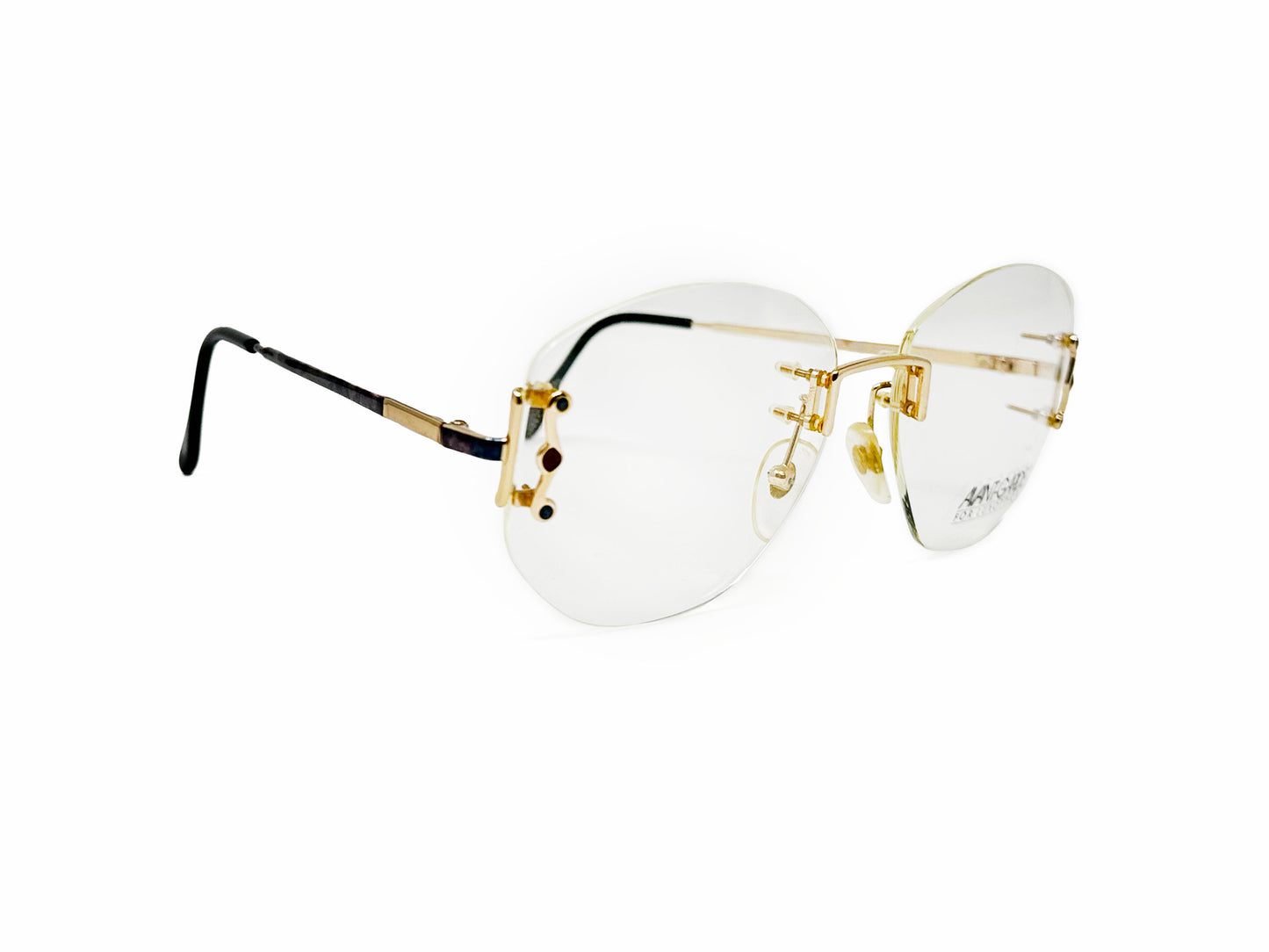 Avant-Garde Luxottica rimless optical frame with gold arms. Model: 7570. Color: G417. Side view.