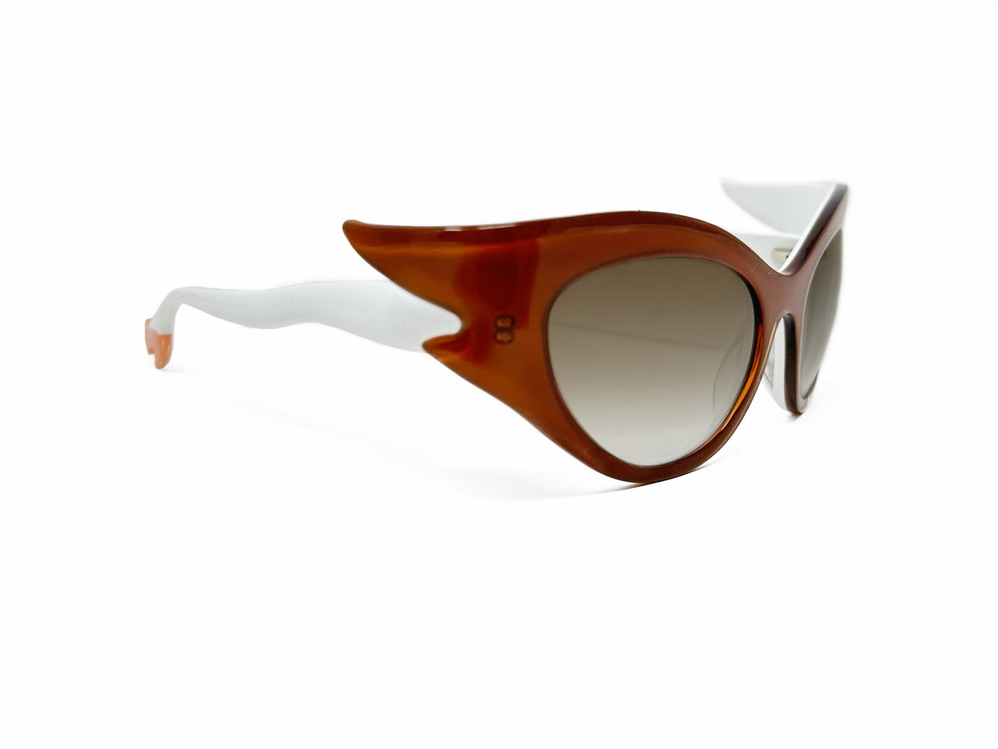Face a Face acetate, cat-eye sunglass with winged corners and temples that look like legs wearing heels. Model: BoccaRock3. Color: 208 - Burnt Sienna with white legs and peach heels. Side angle view.