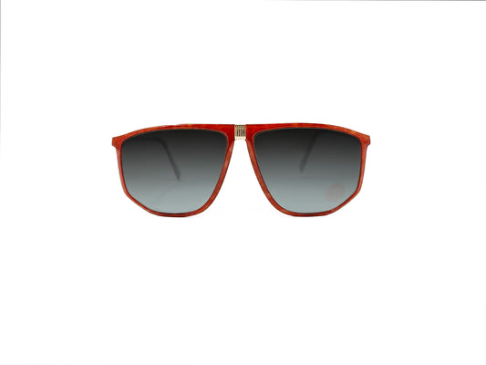 Silhouette oversized, angled aviator style sunglass. Model: 4022. Color: 1258 - Red with gold piece at top of bridge. Front view. 