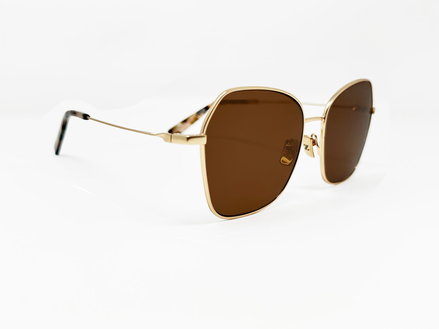 Zeal Optics metal butterfly shaped polarized sunglass. Model: Fillmore. Color: 12716 - Gold with brown lens. Side view.