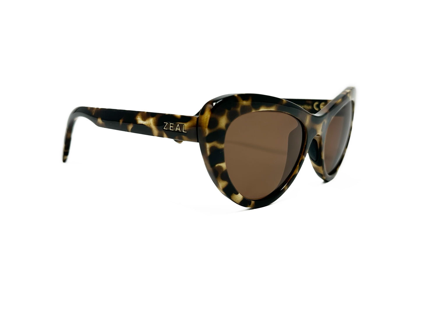 Zeal Optics rounded cat-eye sunglass. Model: Mango. Color: 11683 - Yellow tortoise. Side view.