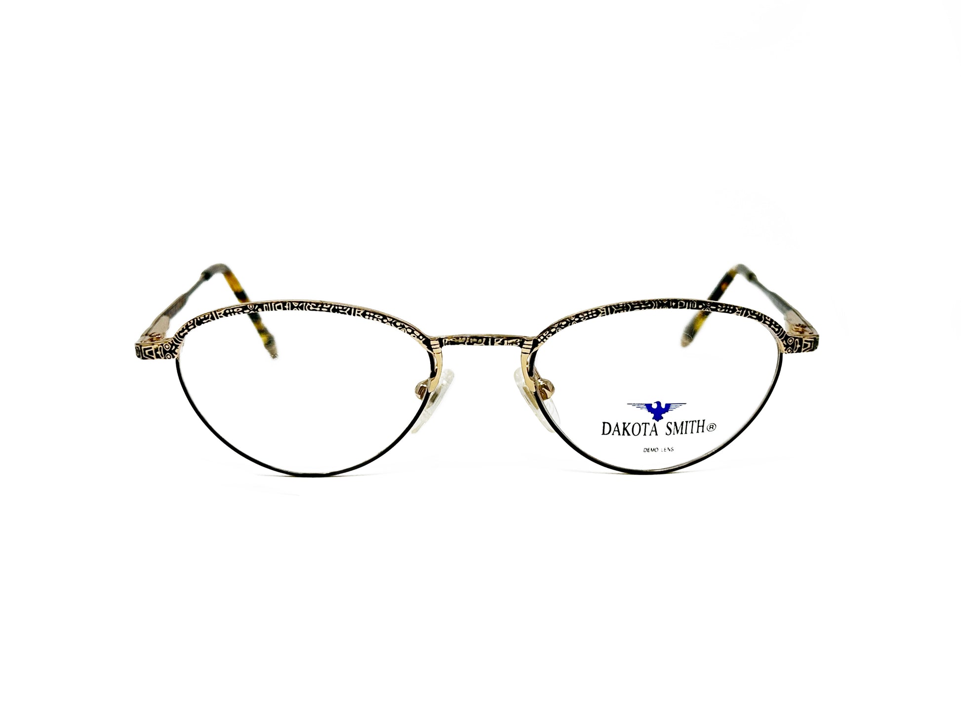 Dakota Smith rounded-triangular, metal, optical frame with etching. Model: 1228n Eskimo. Color: Aged Gold. Front view. 