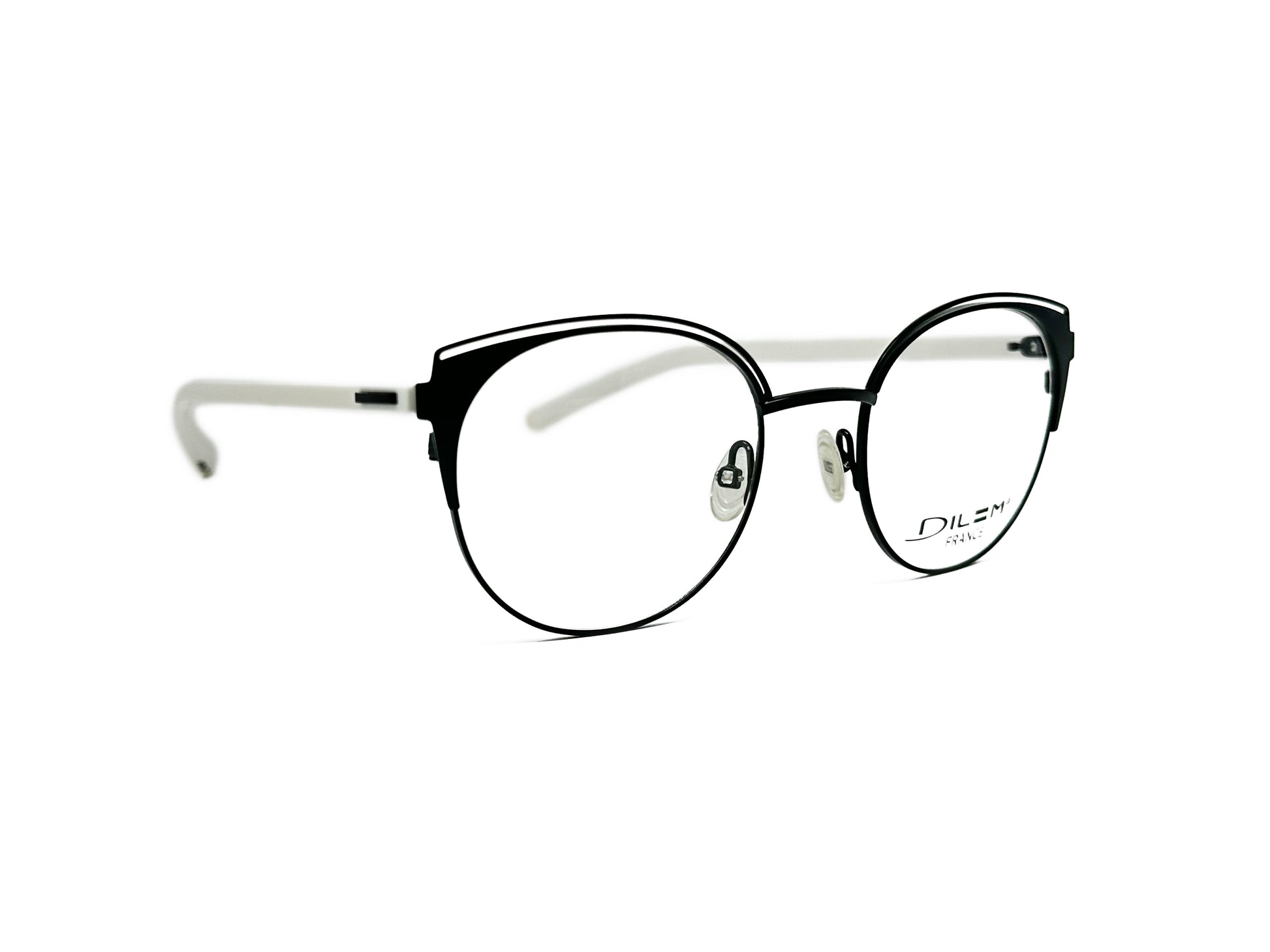 DIlem round, metal optical frame with slight cat-eye tips and cut-out at top of frame. Model: ZF009. Color: 2IA01 - Black with white temples. Side view.
