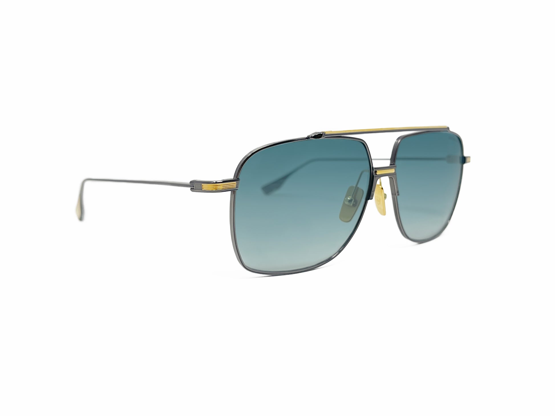 Dita squared aviator style sunglass with bar across top. Model: Alkamx. Color: 02 - Gunmetal with gold accents and blue gradient lenses. Side view.
