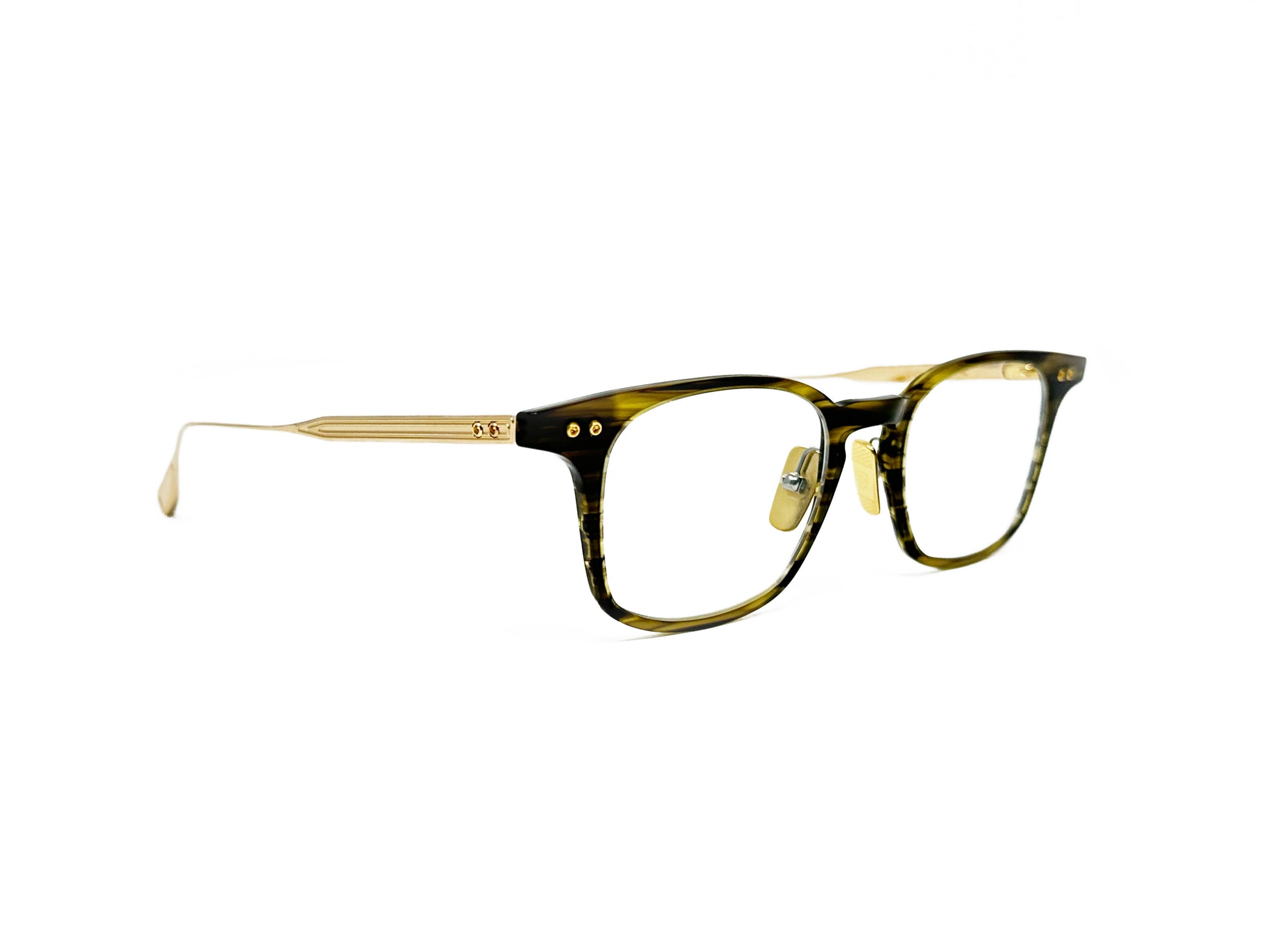 Dita square, acetate, optical frame with gold metal temples. Model: Buckeye. Color: 02 - Timber Brown, light yellow-based brown wood pattern. Side view.