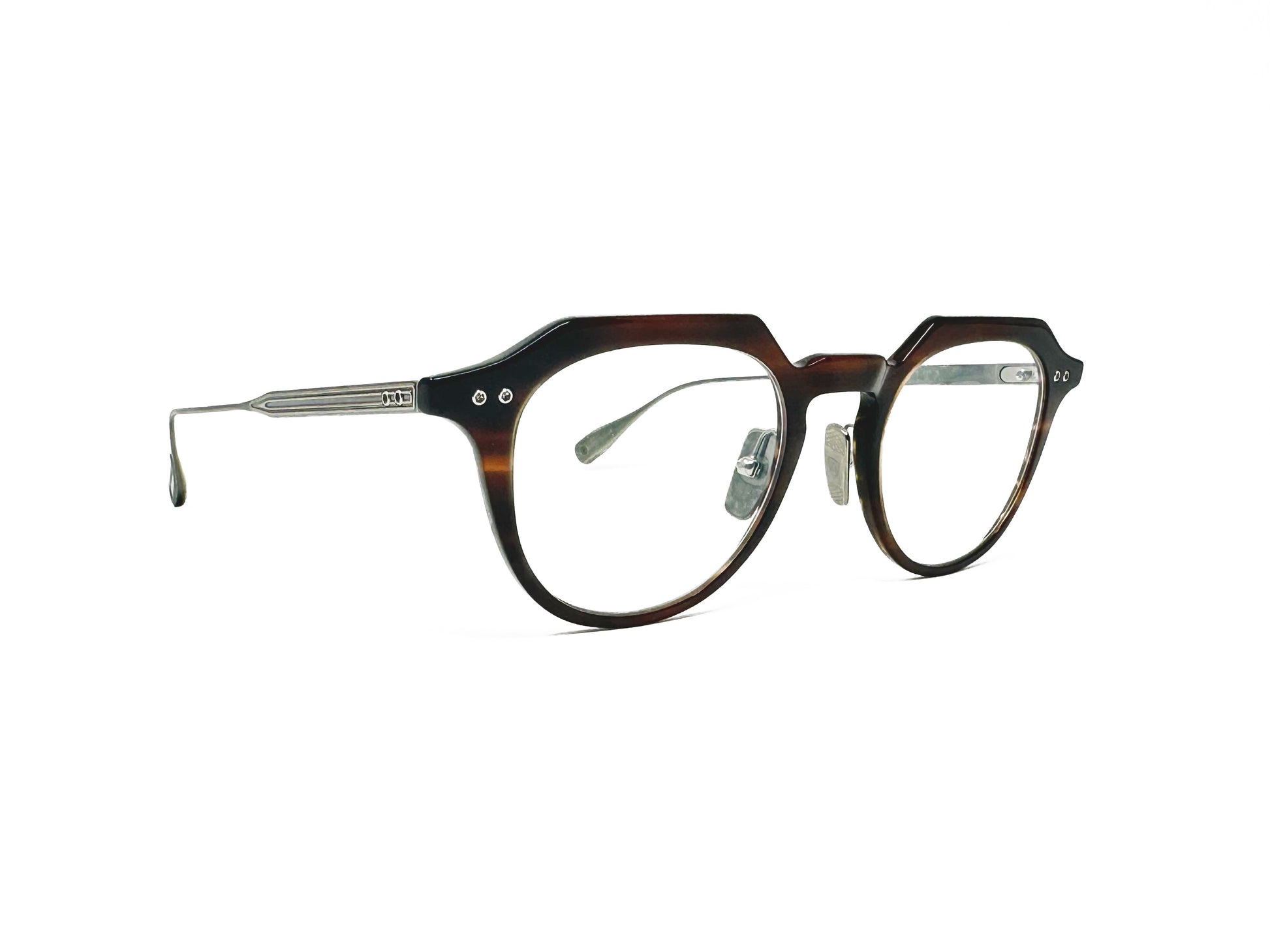 Dita Eyewear rounded optical frame with flat-top and keyhole bridge, acetate front with metal temples. Model: Oku. Color: 02 - Chestnut Swirl with antique silver temples. Side view.