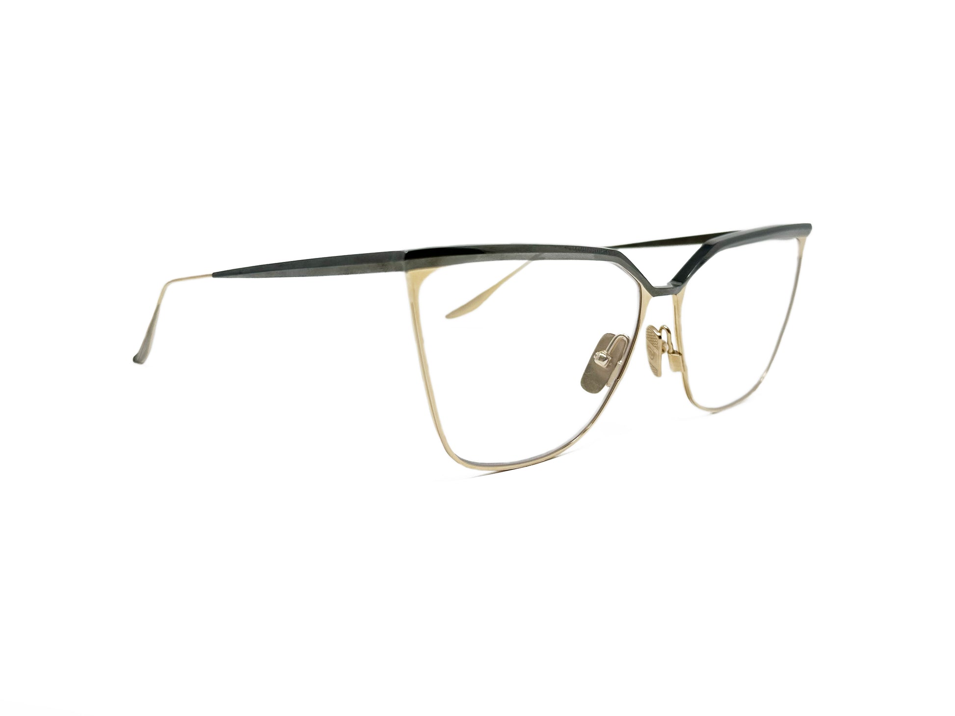 Dita Eyewear metal, angular, cat-eye optical frame. Model: Ravitte. Color: 03 -Gold with a silver trim on top. Side view.