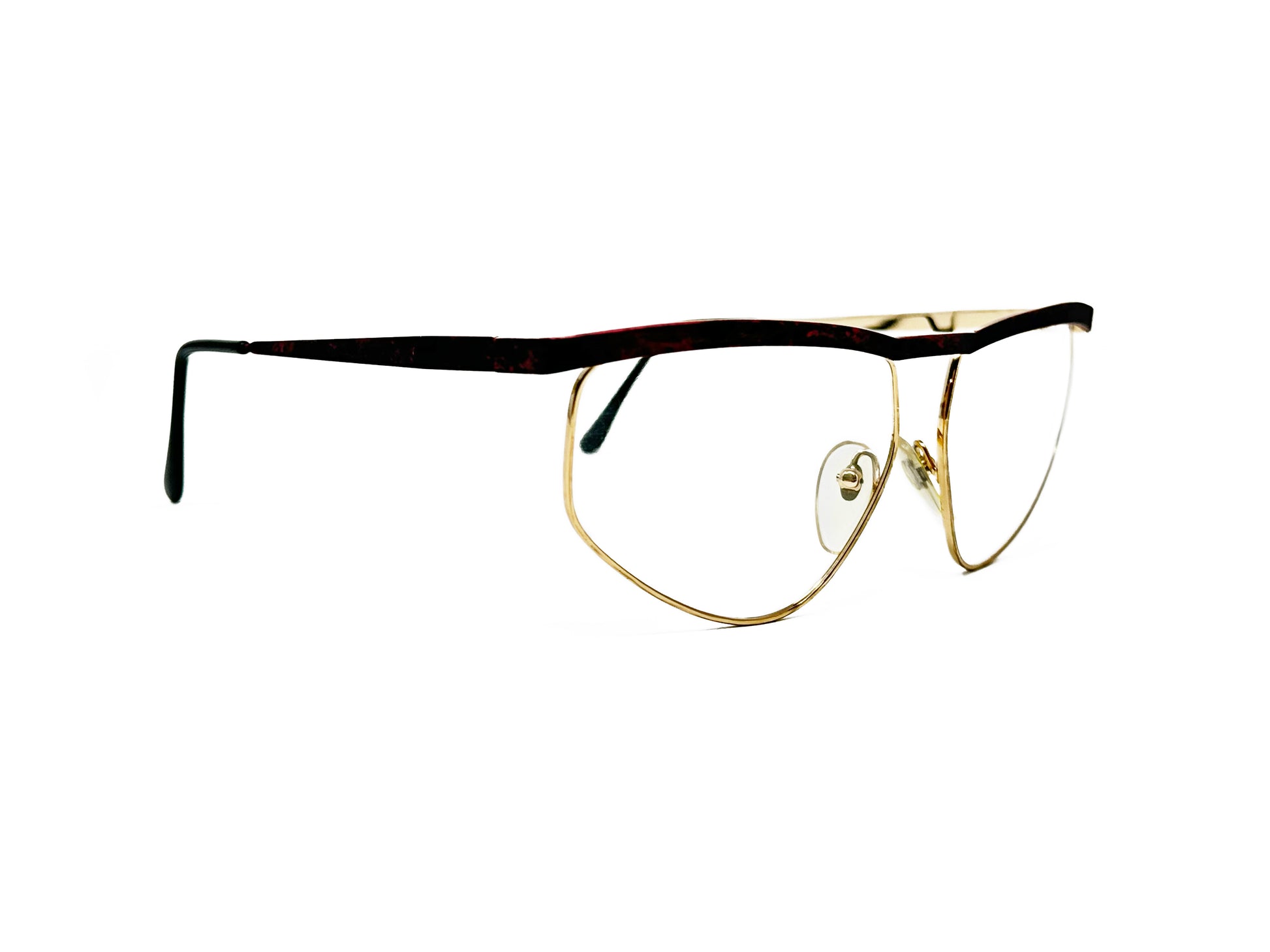 Essence large, geometric, half-rim optical frame with slight flat-top. Model: 01. Color: Gold/Mauve. Side view.