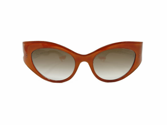 Face a Face acetate, cat-eye sunglass with winged corners and temples that look like legs wearing heels. Model: BoccaRock3. Color: 208 - Burnt Sienna with white legs and peach heels. Front view. 