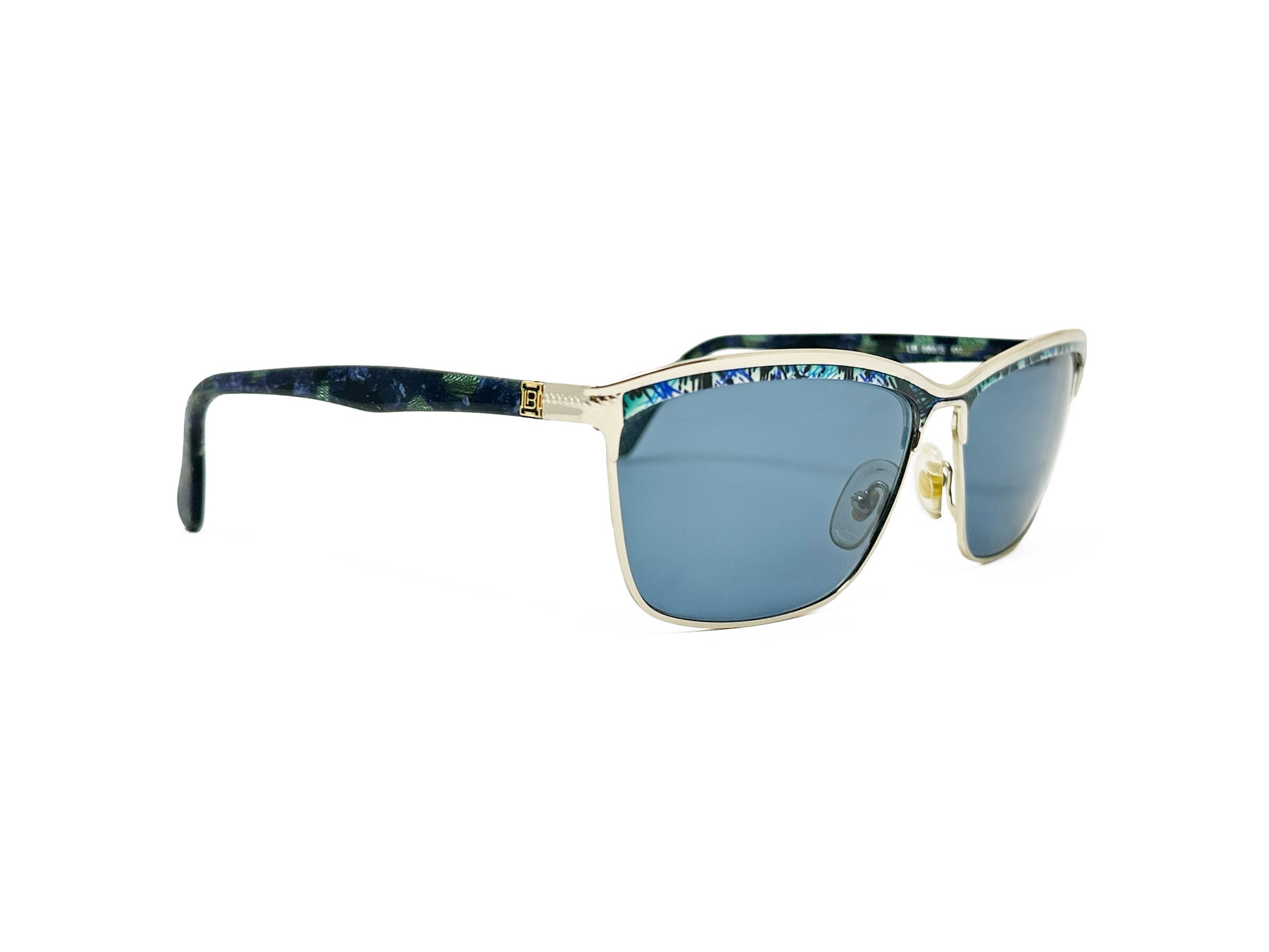 Luara Biagotti rectangular, slight cat-eye sunglass. Model: LB688/S. Color: RT7 - Gold metal with blue patterned trim at top. Side view.