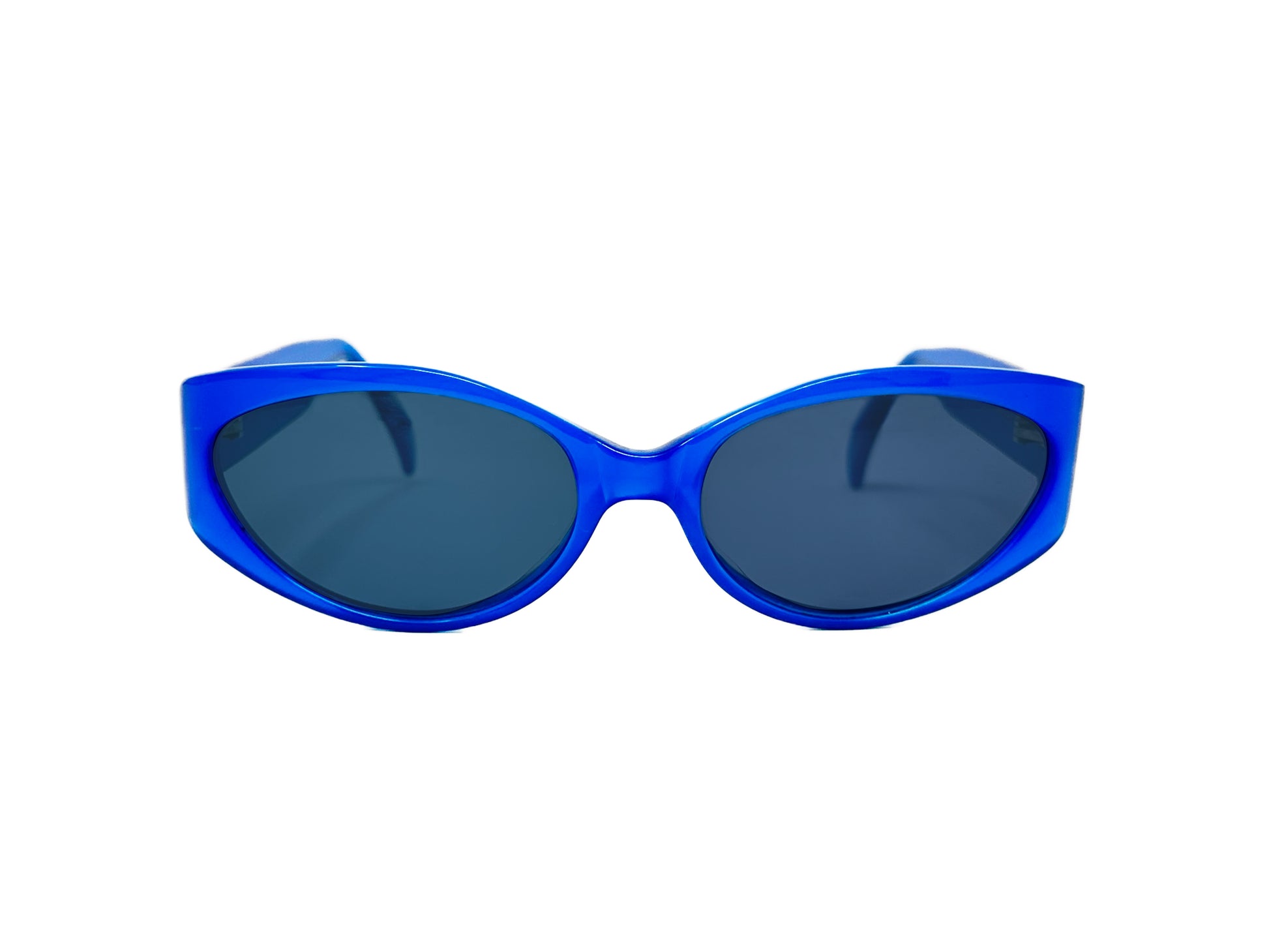 Nicole Miller oval acetate sunglass with flat sides and uplifted lens. Model: 1326 Angels. Color: Blue Frost 1464. Front view. 