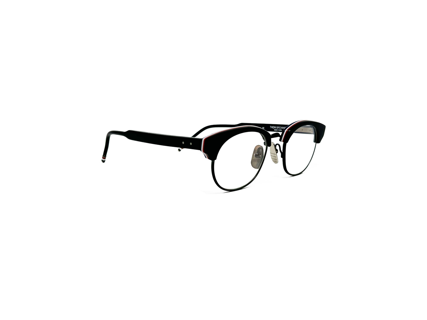 Thom Browne rounded half-rim optical frame. Model: 702. Color: Black with silver metal nose pads. Side view.