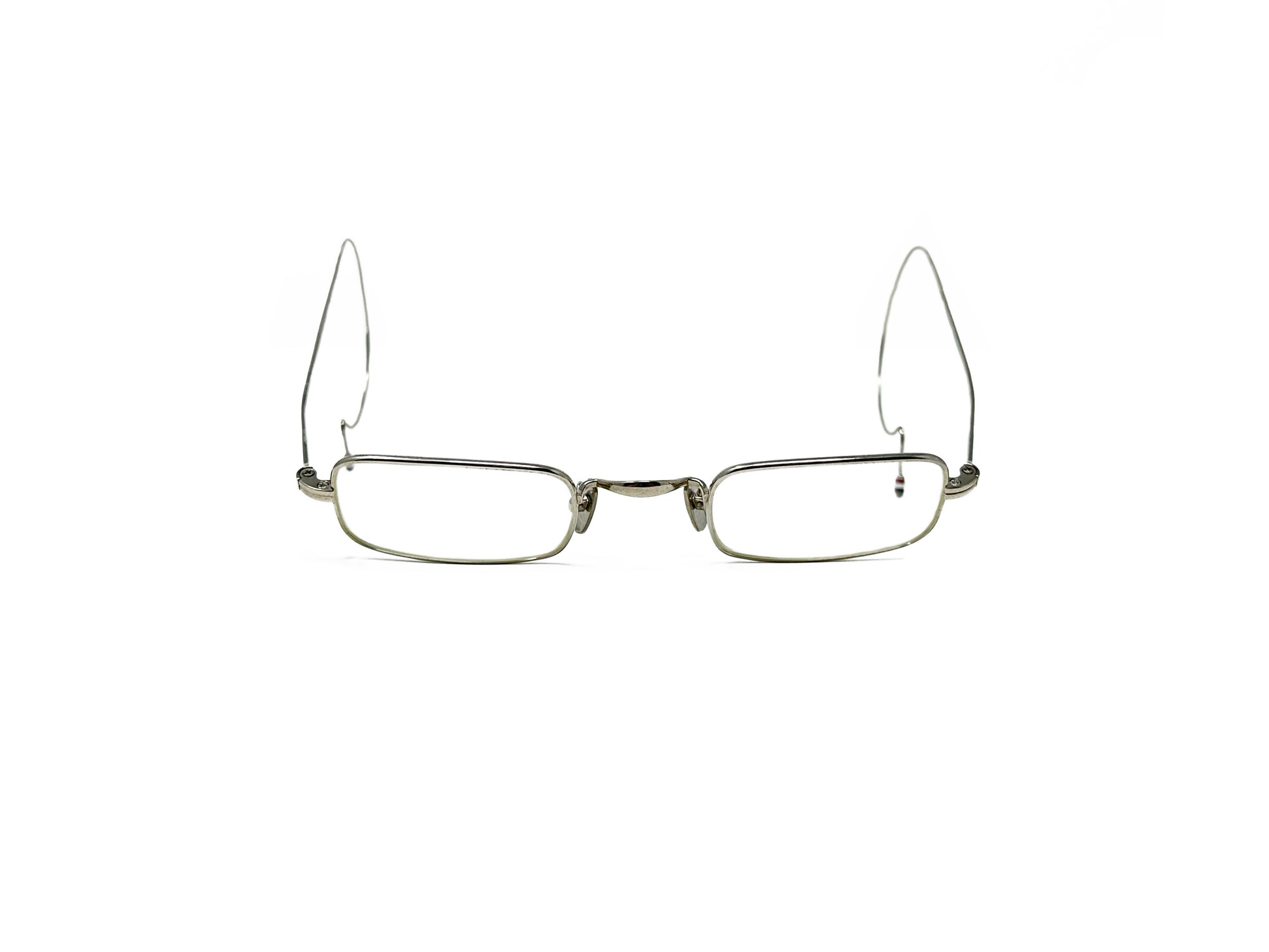 Thom Brown rectangular metal optical frame with cable temples. Model: TB900. Color: Silver. Front view open.
