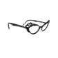 Traction acetate cateye optical frame with a wavy top and oval cut-outs. Model: Pistel. Color: Resille - Transparent with black and red dots. Side view.