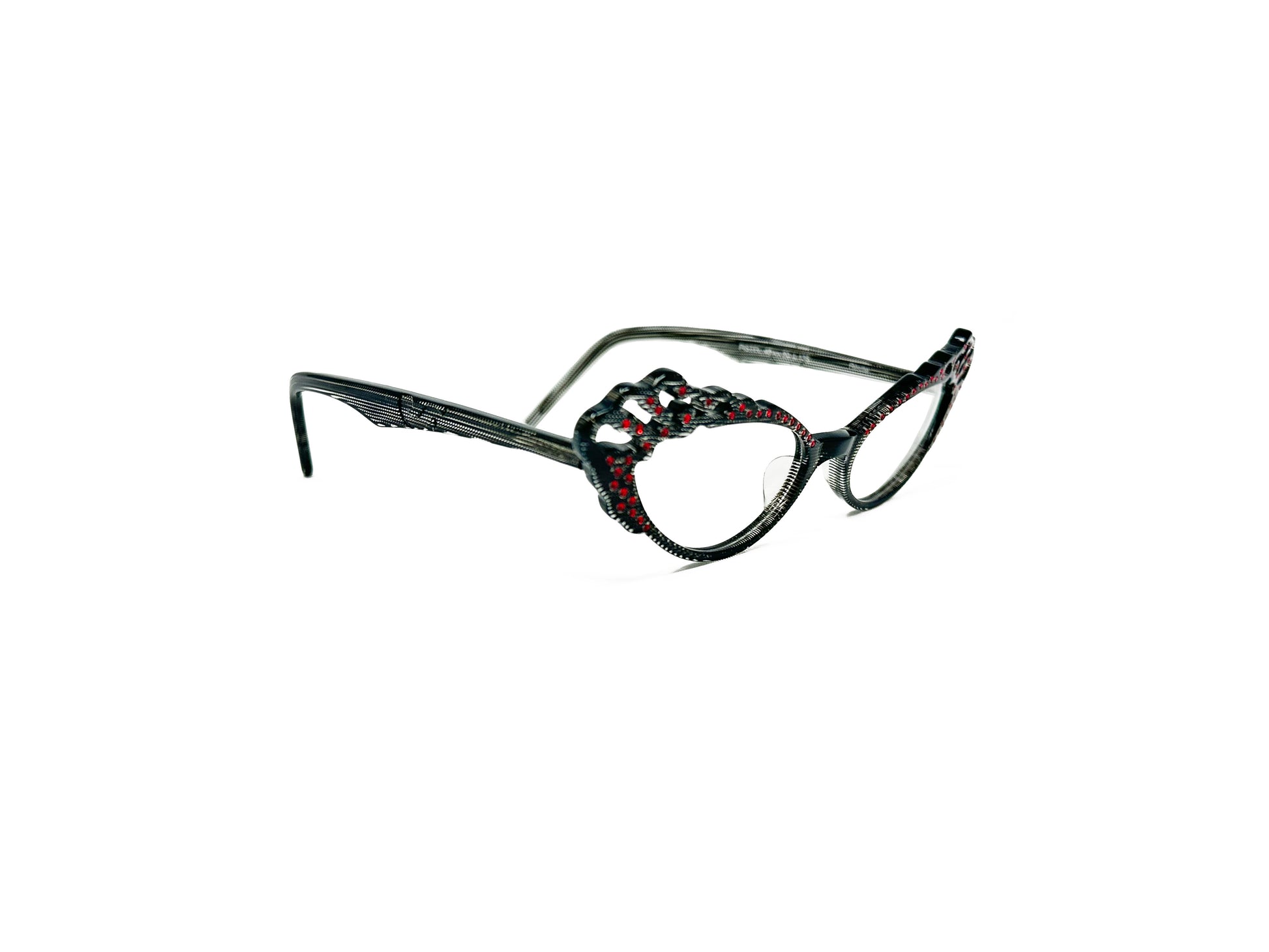 Traction acetate cateye optical frame with a wavy top and oval cut-outs. Model: Pistel. Color: Resille - Transparent with black and red dots. Side view.