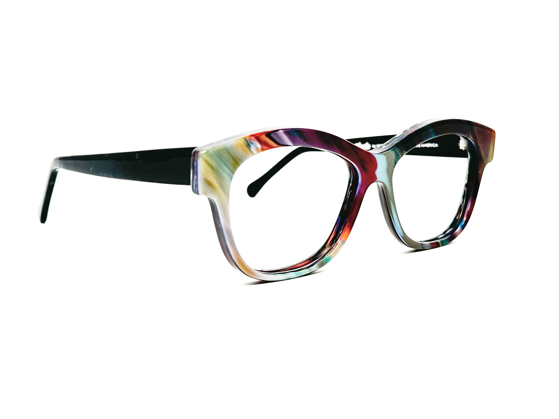 Viktlos recycled acetate optical frame. Square shaped with soft, lifted angles and v-curve on top of frame. Model: RC013. Color: 2638 - Cool toned multi-color. Side view.
