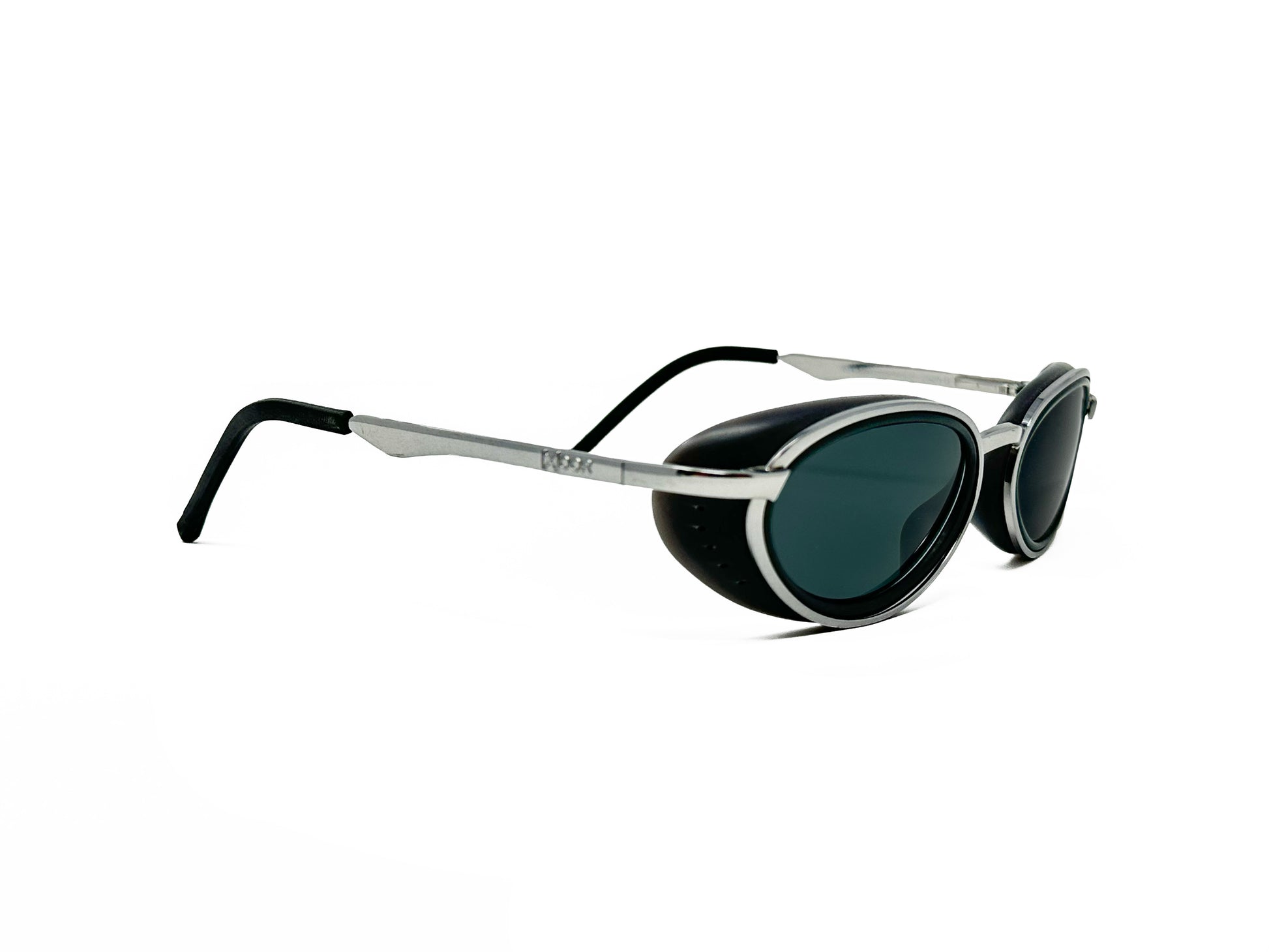 [X]OOR upward-angled, oval, metal, polarized sunglass. Model: 2925. Color: B - Silver with grey lenses. Side view.