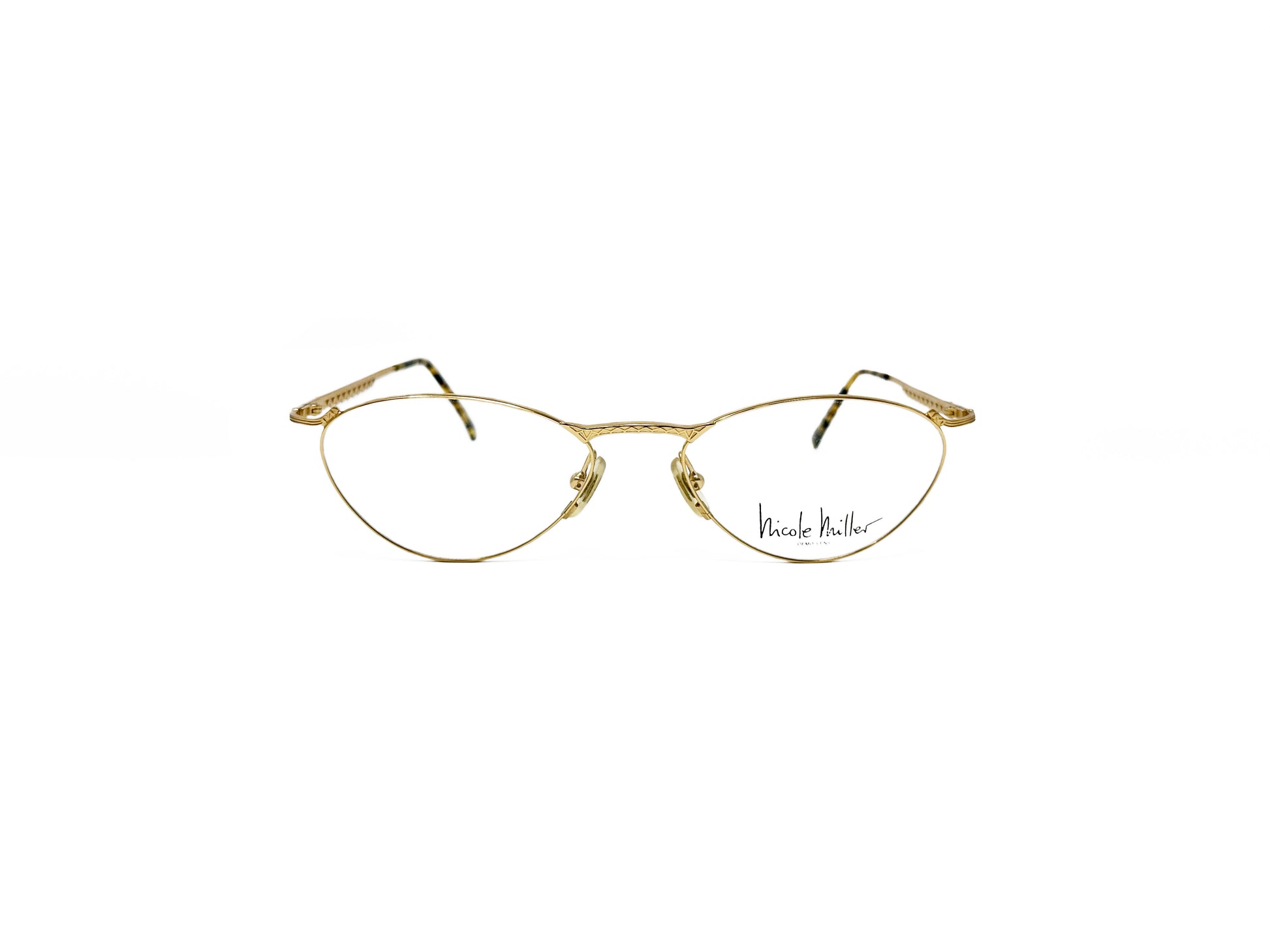 Nicole Miller oval, angular, wire optical frame. Model: Electricia. Color: Gold 0229. Front view. 