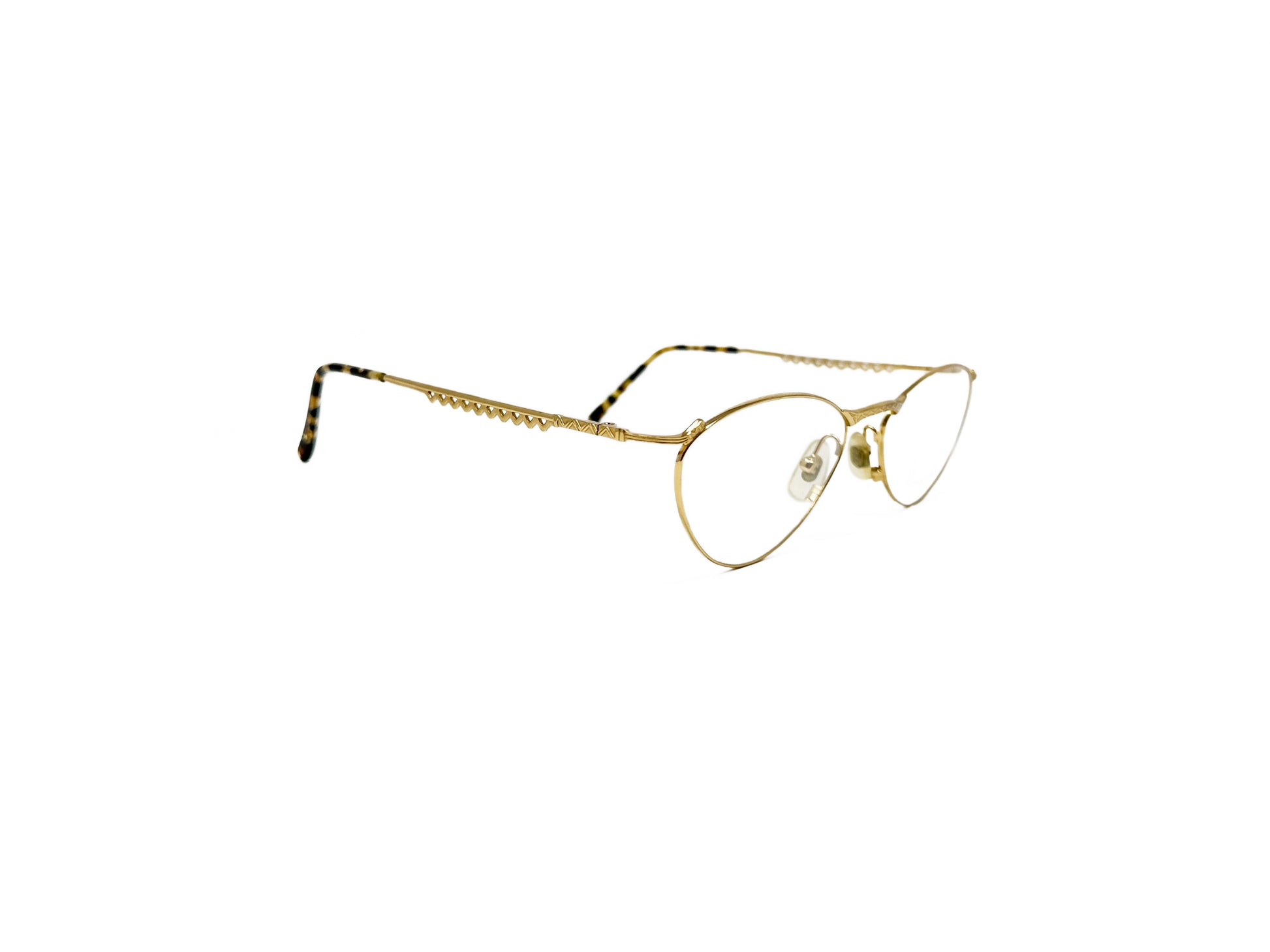 Nicole Miller oval, angular, wire optical frame. Model: Electricia. Color: Gold 0229. Side view.